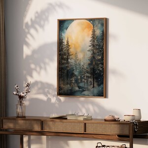 May include: A watercolor painting of a full moon rising over a dark forest. The moon is a bright yellow and the trees are silhouetted against the night sky. The painting is framed in a dark wood frame.