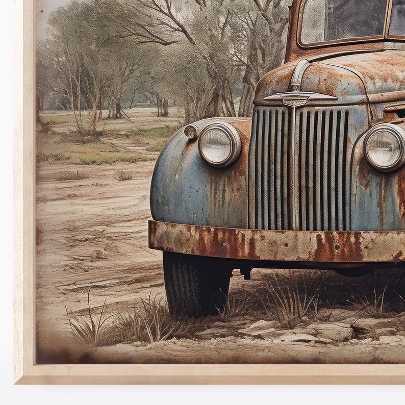May include: A vintage blue and rusty truck parked in a dirt field with trees in the background.