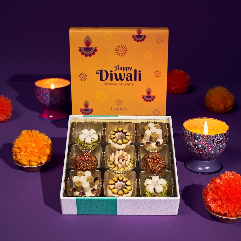 A yellow gift box with nine sweets in it on a purple background