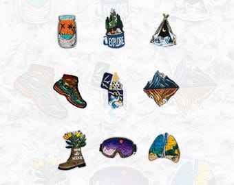 May include: A set of ten embroidered iron-on patches featuring various outdoor adventure themes. The patches include a campfire, a tent, a mountain range, a pair of hiking boots, a jar with palm trees, a lighter, a pair of ski goggles, a pair of lungs with trees, and a hiking boot with the text "Take a Hike".