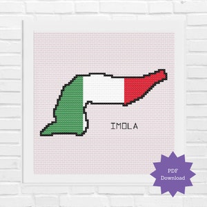 May include: A cross-stitch pattern of the Imola racetrack in Italy, shaped like the Italian flag with green, white, and red sections. The words "IMOLA" are printed below the track.