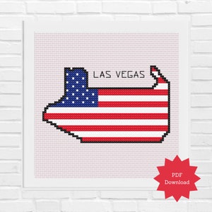 Könnte beinhalten: Ein Kreuzstichmuster des Bundesstaates Nevada in Form der amerikanischen Flagge mit den Worten "LAS VEGAS" über der Flagge.
