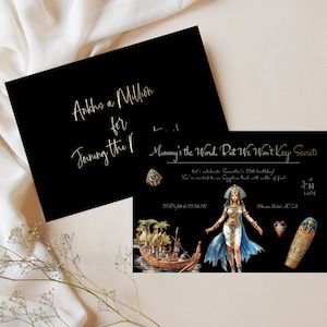 May include: Black and gold invitation with an Egyptian theme. The invitation reads "Ankhs a Million for Joining the Mummy's the Word, Put We Won't Keep Secrets". It also includes an image of an Egyptian woman, a boat, and a sarcophagus.
