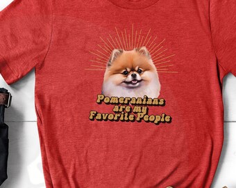 May include: Heather red t-shirt with a Pomeranian dog graphic and the text "Pomeranians are my Favorite People".