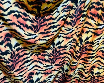 Tiger design exotic animal print on great quality of poly spandex 4-way stretch 58/60”