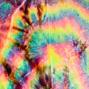 May include: A vibrant tie-dye textile featuring a swirling pattern of rainbow colors. The design includes shades of yellow, green, blue, pink, and brown, creating a psychedelic and artistic effect. The fabric appears textured and crinkled.