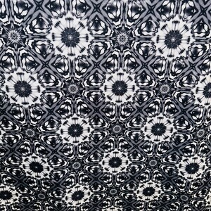 May include: Black and white abstract pattern with a repeating geometric design. The pattern features a series of interlocking circles and squares.