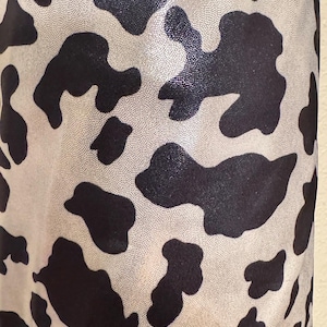 Cow design exotic animal print on best quality of metallic nylon spandex with foggy foil 4-way stretch 58/60” High quality fabrics