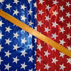Stars design print on hologram metallic nylon spandex 4-way stretch 58/60” Sold by the YD.