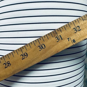 Pin Stripes white/black on best quality of nylon spandex 4-way stretch 58/60” High quality fabrics by EthanLASpandex