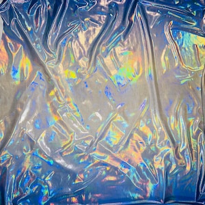 New iridescent metallic Ombré design two tone hologram foil 4way stretch 58/60” Sold by the YD. Ships worldwide from Los Angeles CA USA