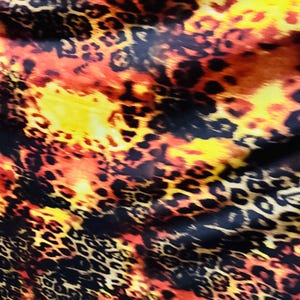 Leopard design exotic animal print Rust/Brown  on best quality of poly spandex 4-way stretch 58/60” Sold by the YD. Ships worldwide