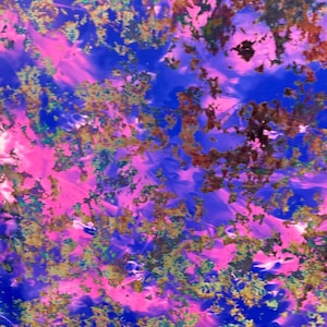 May include: Abstract painting with a swirling pattern of pink, blue, and gold paint. The colors are vibrant and the texture is thick and textured.