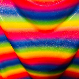 Rainbow design hologram metallic nylon spandex 4-way stretch 58/60” Sold by the YD.