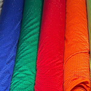 Deluxe Rhinestone design on best quality of nylon spandex base 4-way stretch 58/60” Sold by the YD. High quality fabrics by EthanLASpandex