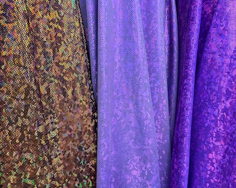 Holograma de vidrio roto en varios colores. Nailon spandex metalizado. Elástico en 4 direcciones. 58/60". Tejidos de alta calidad de EthanLASpandex.