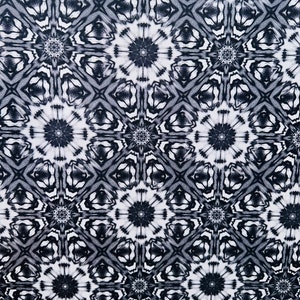 May include: Black and white abstract pattern with a repeating geometric design. The pattern features a series of interlocking circles and squares.