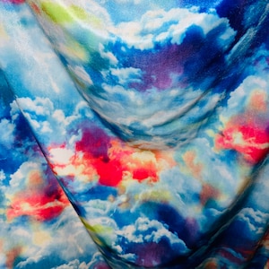 New Vivid Celestial clouds design print on great quality of stretch velvet 4-way Stretch 58/60” Sold by the YD. Ships worldwide from Los Ang
