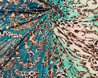 Nowy wzór Hiding Leopard w kolorze jadeitu/złotego nadruku na poliestrowym spandexie z dwukierunkowym rozciągliwym foliowym materiałem. Rozmiar: 58/60 cali. Sprzedawane przez YD. Wysyłka na cały świat z Los Angeles.