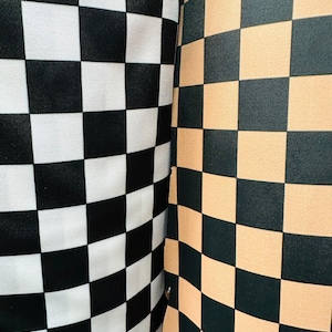 Checkers design print on great quality of nylon spandex 4-way stretch 58/60” Sold by the YD.