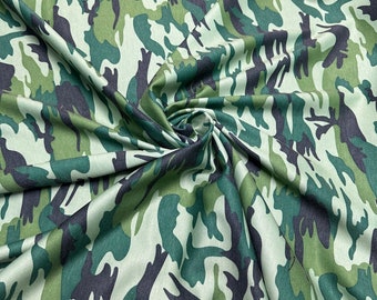 Camouflage design army green print on Poly spandex ponte de Roma 2-way stretch 58/60” Sold by the YD. Ships worldwide from LA