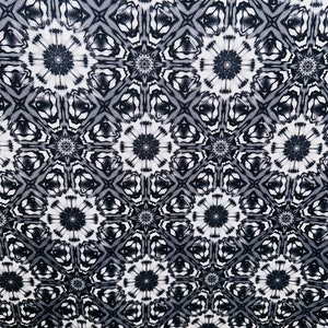 May include: Black and white abstract pattern with a repeating geometric design. The pattern features a series of interlocking circles and squares.