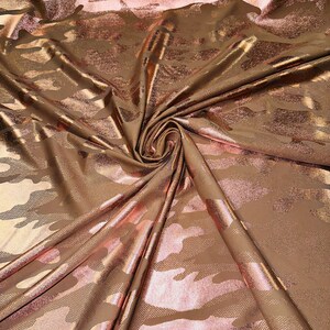 Camouflage design on metallic nylon spandex Nude/Rose gold 4-way stretch 58/60” Sold by the YD. Ships worldwide from Los Angeles California