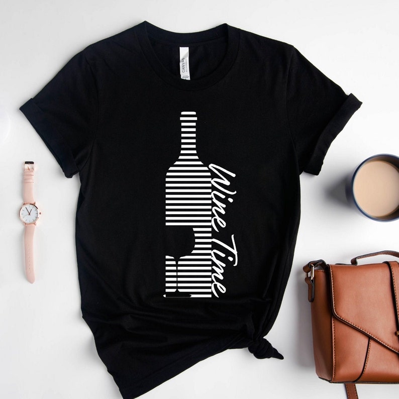 May include: Black t-shirt with a white striped design of a wine bottle and glass with the text "Wine Time" written vertically.