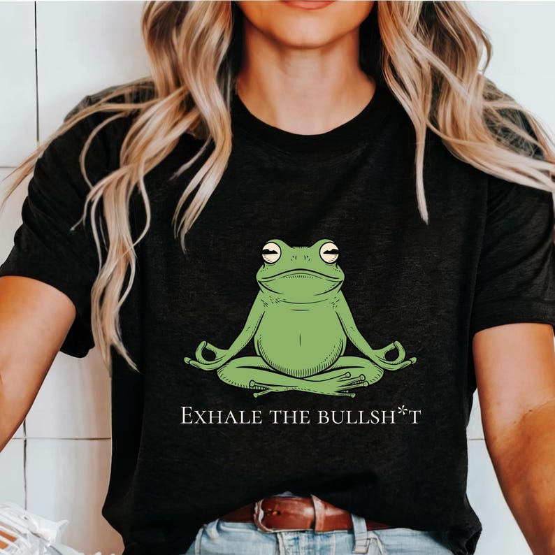 May include: Black t-shirt with a green frog meditating and the text "Exhale the Bullsh*t".