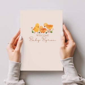 May include: A cream-coloured baby announcement card with watercolour illustrations of three yellow chicks and floral accents. The text "WELCOME Baby Byron" is written in a delicate script font.
