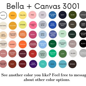 May include: A color chart showing 48 different colors for Bella + Canvas 3001 t-shirts. The colors are arranged in rows and columns, with each color represented by a small circle.