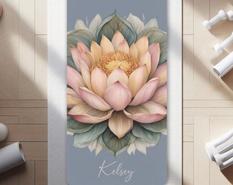 May include: A light blue yoga mat with a pink and yellow lotus flower illustration and the name "Kelsey" printed in white.