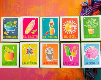 May include: A set of ten rectangular cards featuring colorful illustrations of Mexican cultural icons including El Guacamole, El Elote, El Tajin, El Sol, Los Nopales, La Margarita, La Piñata, La Horchata, Las Paletas, and La Concha with their names.