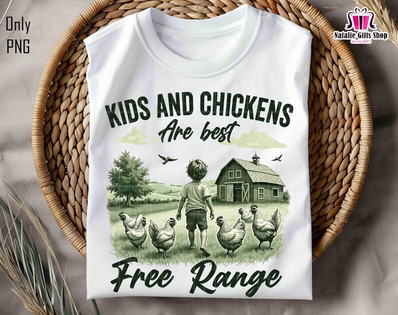 May include: White t-shirt with a green and brown illustration of a child and chickens in a field. The text "Kids and Chickens are best Free Range" is printed on the shirt.