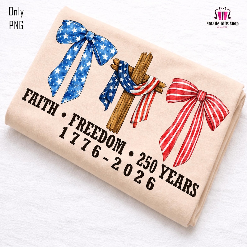 May include: A beige fabric with patriotic designs. Features a blue bow with white stars, a wooden cross draped with a red, white, and blue scarf, and a red and white striped bow. Text reads "FAITH &bull; FREEDOM &bull; 1776-2026 &bull; 250 YEARS."