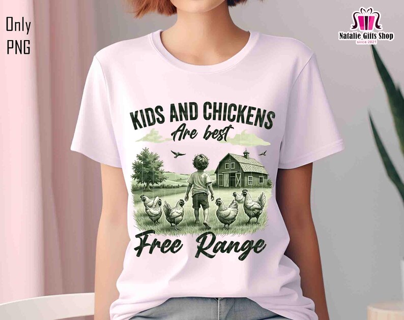 May include: A white t-shirt with a green and black illustration of a child and chickens in a field. The text "Kids and Chickens are best Free Range" is printed on the shirt.