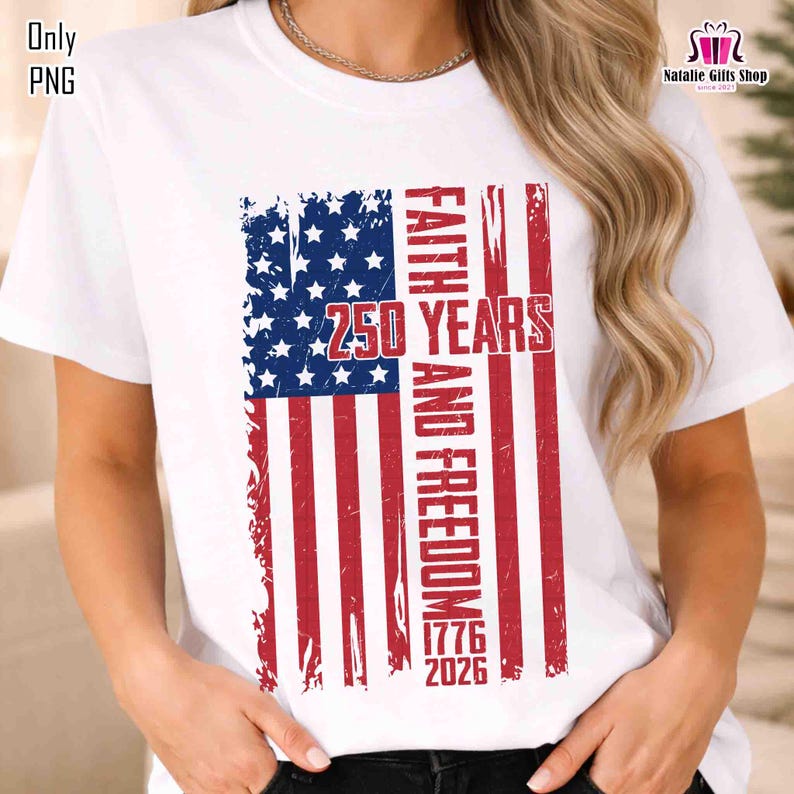 May include: White t-shirt featuring a distressed American flag design with the text "FAITH AND FREEDOM 250 YEARS 1776-2026". The flag design includes blue stars and red and white stripes, celebrating a patriotic theme.