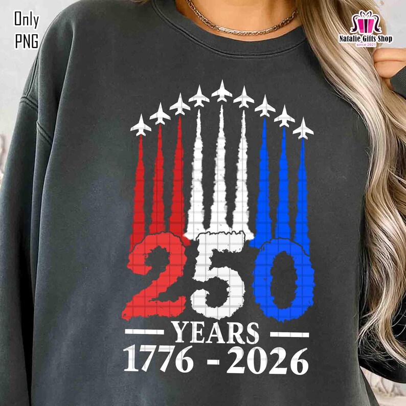 May include: Dark gray sweatshirt with a graphic design featuring jets leaving red, white, and blue vapor trails. The number "250" is displayed with the words "YEARS 1776-2026" below the number. The upper left corner says "Only PNG".