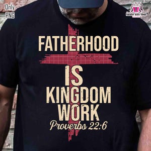 May include: Black t-shirt with the text "FATHERHOOD IS KINGDOM WORK Proverbs 22:6" in a cream color. A red cross shape is behind the text. The shirt is a crew neck.