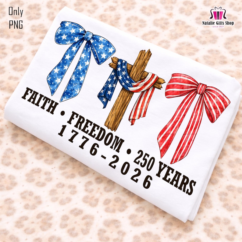 May include: White fabric with patriotic designs. Features a blue bow with white stars, a wooden cross draped with a red, white, and blue flag, and a red and white striped bow. Text reads "FAITH &bull; FREEDOM &bull; 250 YEARS 1776-2026".