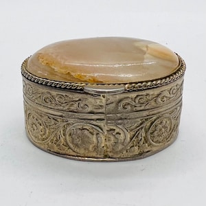 Vintage ornate oval shaped pill box with metal and onyx stone