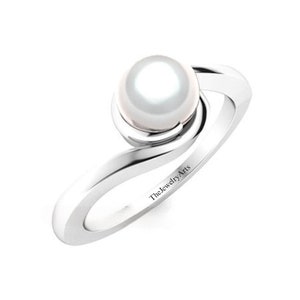 May include: A silver ring with a white pearl set in a swirl design. The ring is engraved with the text "TheJewelryArts".