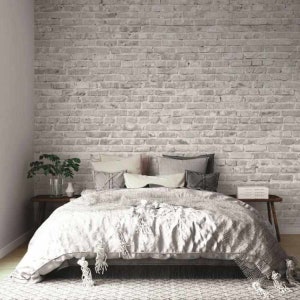 Brick wall wallpaper in a gray and white shade.