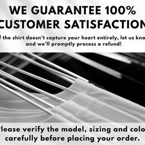 May include: Image features white t-shirts hanging on metal hangers. Text at the top reads "WE GUARANTEE 100% CUSTOMER SATISFACTION." Below, it states, "if the shirt doesn't capture your heart entirely, let us know and we'll promptly process a refund!"