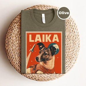 Camiseta de Laika, perro espacial, camiseta gráfica vintage de Laika, camiseta para amantes del espacio, perro Laika retro, camiseta de carrera espacial, camiseta con póster de perro de la URSS