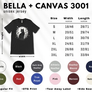 May include: Black unisex jersey t-shirt with a cat illustration inside a circular frame. The shirt features a crew neck and short sleeves. Available in various colors and sizes, with measurements in inches and centimeters.