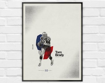 May include: A framed poster featuring a black and white illustration of Tom Brady in a football uniform, accented by blue and red geometric shapes. The text reads Tom Brady, Comeback Kid, New England 12 Football, and Patriots in a clean layout.