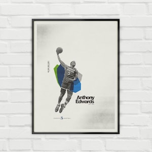 May include: A framed poster featuring basketball player Anthony Edwards in action, mid-air, about to shoot a basketball. The poster has a minimalist design with geometric shapes in green and blue, and the text "Anthony Edwards" and "Minnesota 5 Basketball".