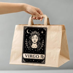 May include: A brown paper tote bag with a black and white illustration of a woman with a flower crown and the text "VIRGO ♍".