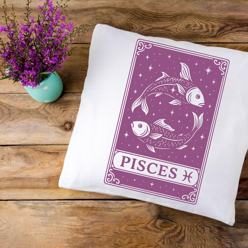 May include: White pillow with a purple design featuring two stylized fish and the text "Pisces" with the Pisces astrological symbol.